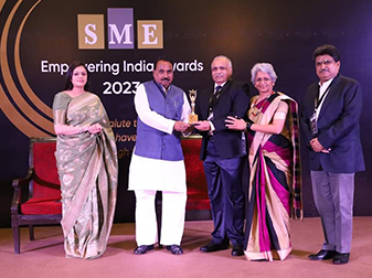 Mr. Milind Thekedar, Mrs. Nayan Thekedar and Mr. Sanjiv Datta receiving trophy in the category Engineering, Procurement and Construction